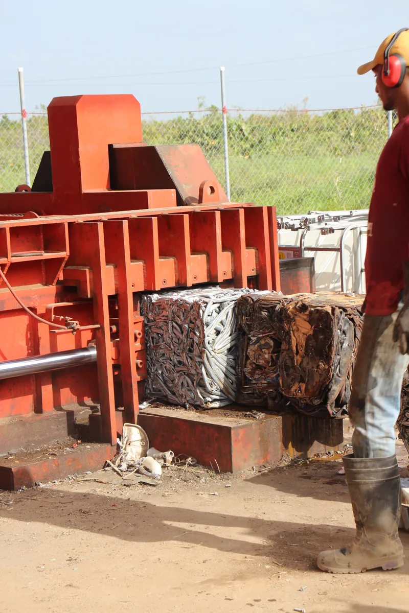 Compressed scrap metal bales at the CEVONS recycling facility, ready for export