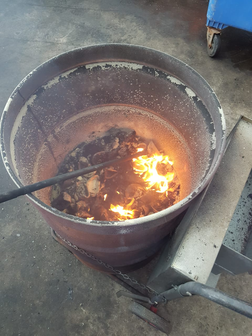 Second view of the CEVONS barrel incinerator burning oily rags and PPE